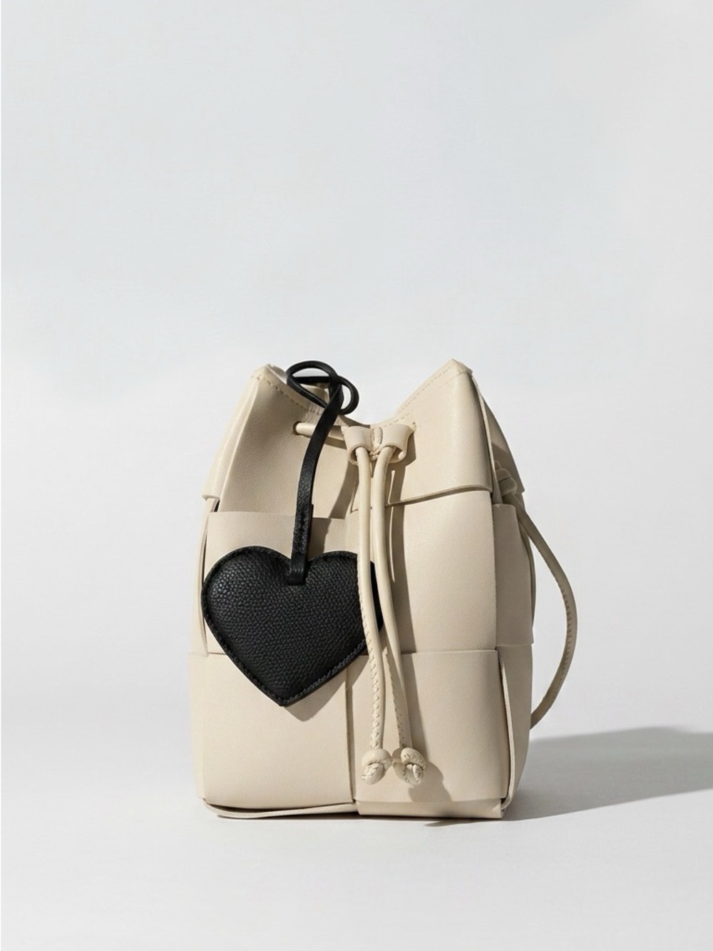 Ivory Woven Bucket Bag with Black Heart Charm